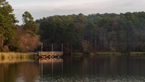 peaceful lakeside morning with fishing pier