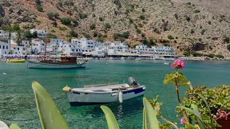 Port-of-Loutro-village,-boats,-clear-water,-exotic-buildings-in-Crete