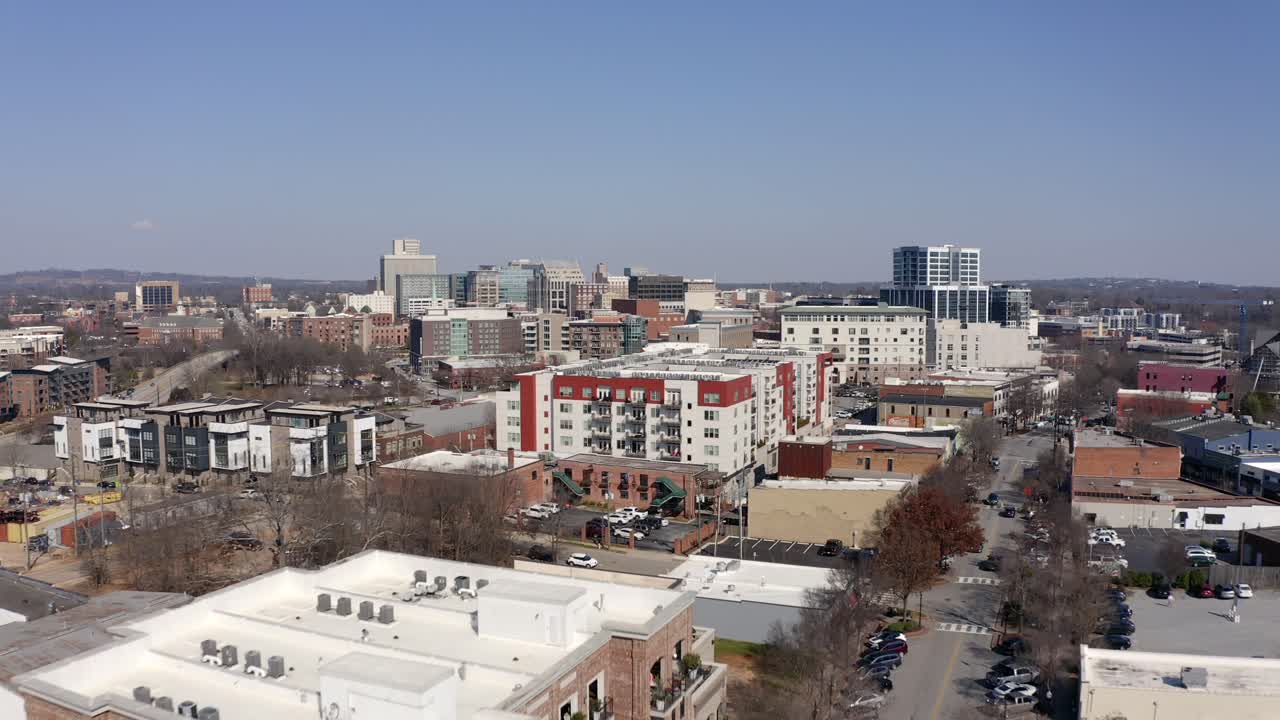Fast aerial flight towards downtown Greenville South Carolina in winter