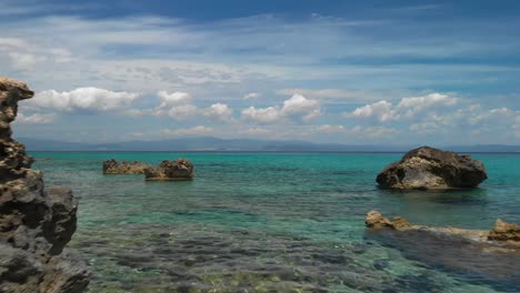 Sunny-day-on-the-coast-of-Halkidiki-with-blue-water-and-blue-sky