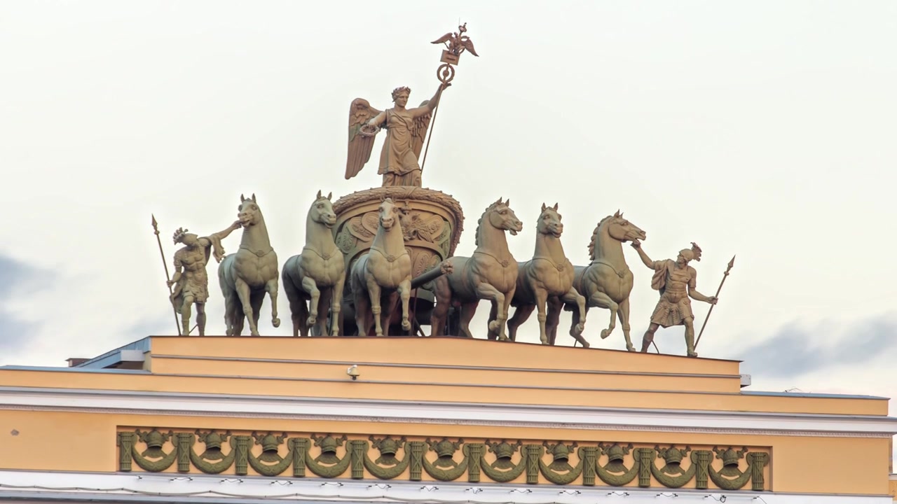 Chariot of Fame sculptural group on the Headquarters roof, Saint-Petersburg, Russia. Timelapse hyperlapse of detailed view, lit by sunset sunlight