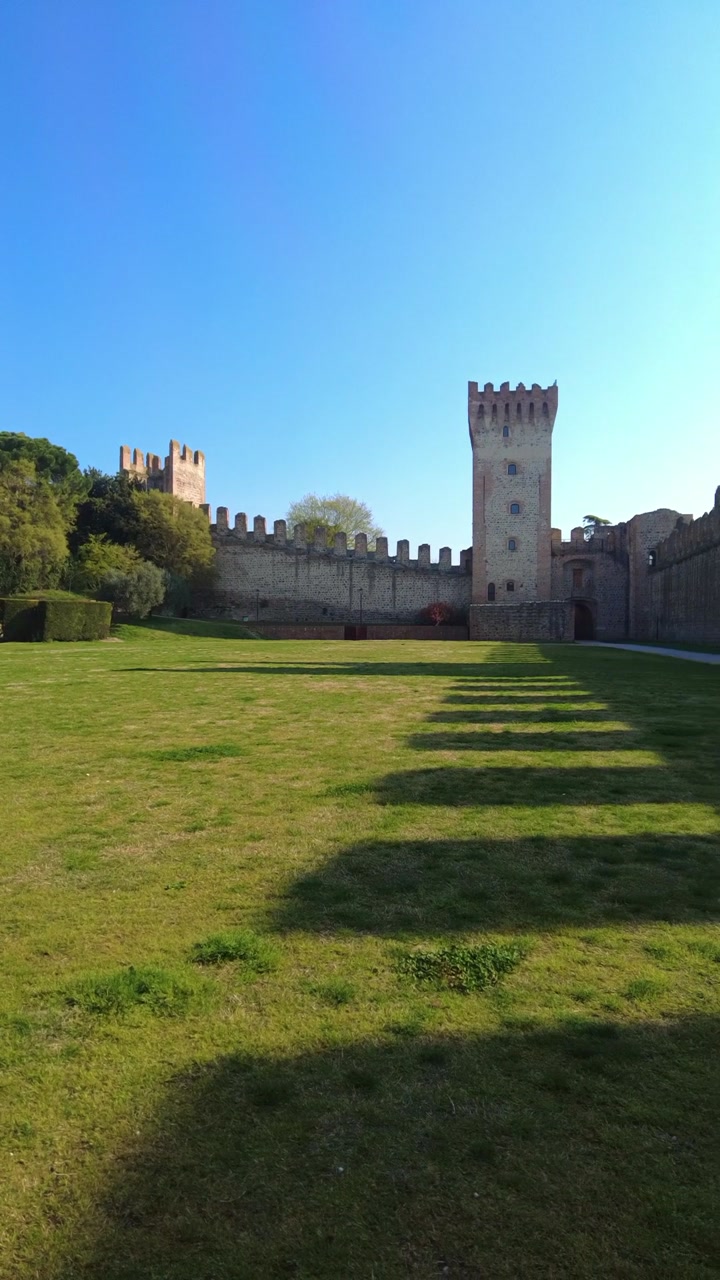 Exploring Este Castle in Padua, Italy on a sunny day with clear sky and open path