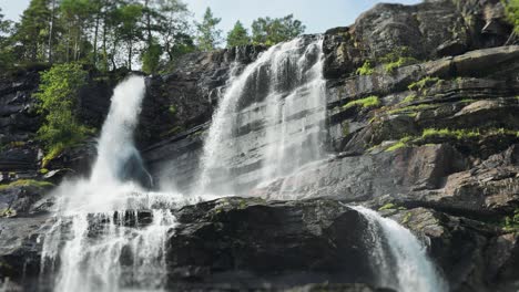 tvindefossen waterfall cascades over the rocky cliffs