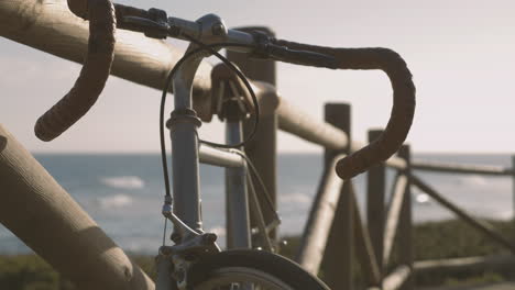 bicycle parked on the boardwalk near the beach 1