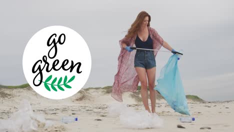 animation of go green text and logo over smiling caucasian woman picking up rubbish from beach