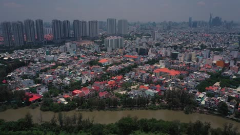 Aerial-suburban-view-on-sunny-day-housing-development-on-river