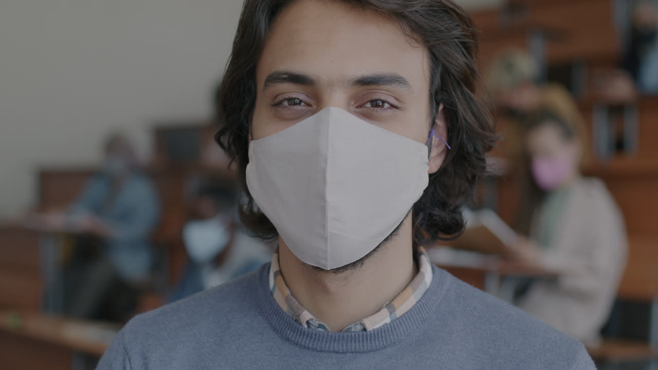 Student in a Classroom Wearing a Mask