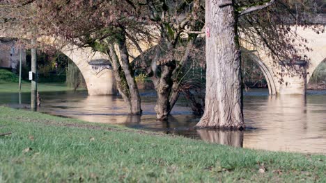 flooded banks after heavy rain in the dordogne, castelnaud la chapelle