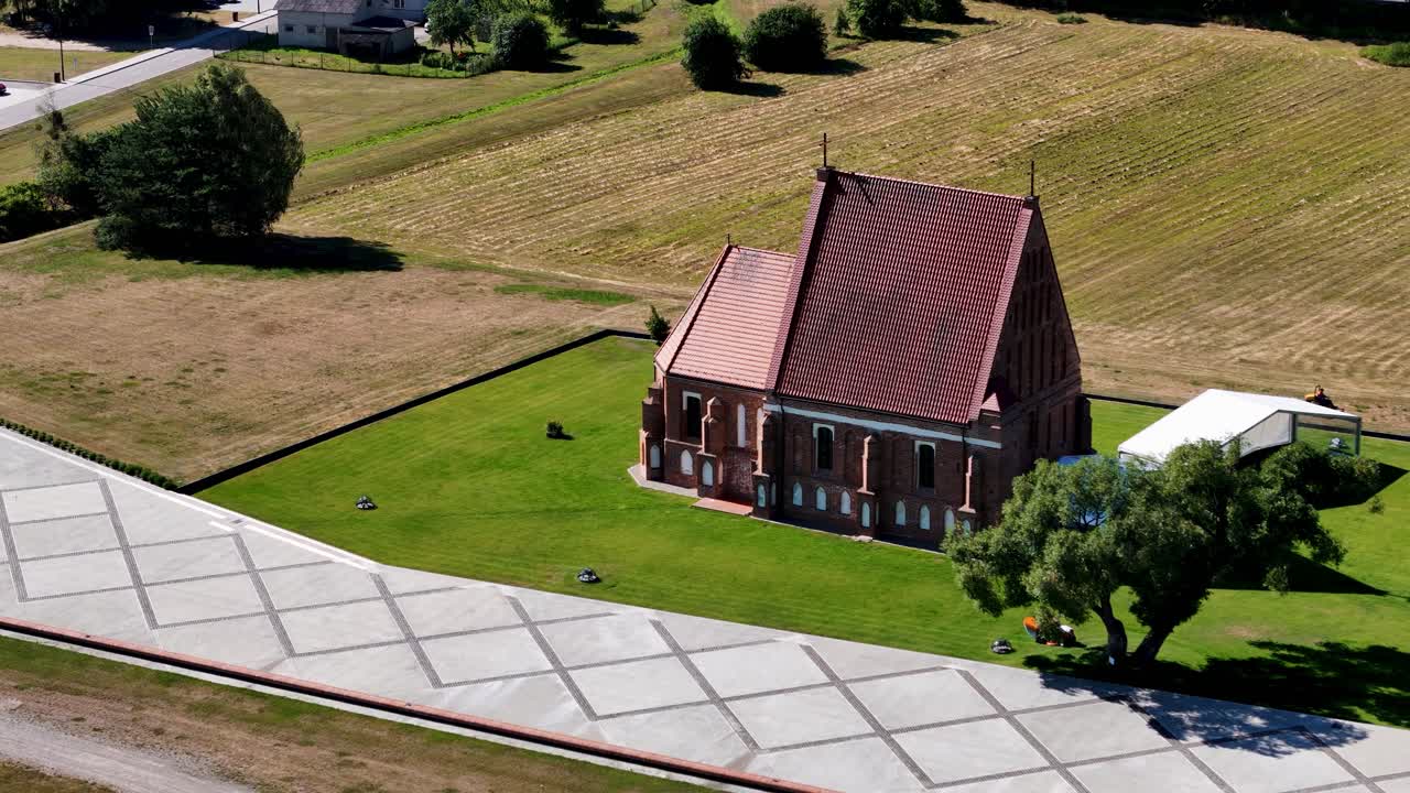 Beautiful red color church, aerial orbit zoomed view