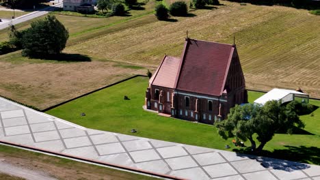 beautiful red color church, aerial orbit zoomed view