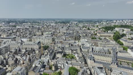 Aerial-traveling-push-in-wide-drone-shot-of-Rennes-city-center,-Bretagne,-France