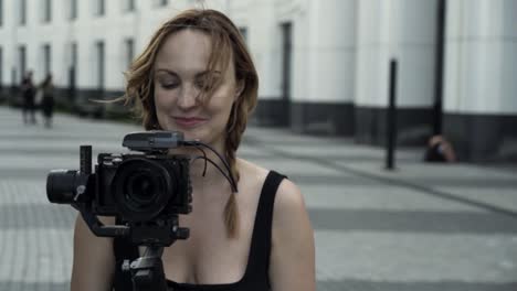 woman filming video outdoors