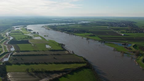 aerial view of a flooded river and surrounding farmland