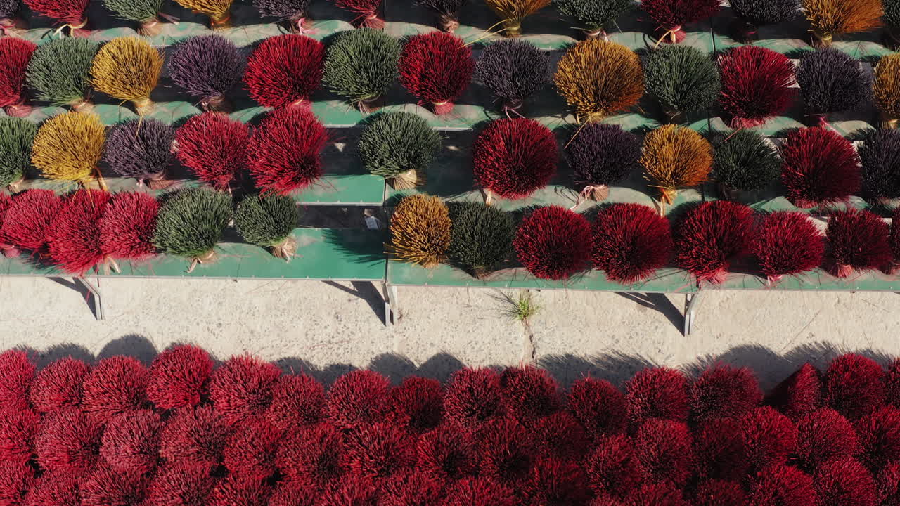 Dynamic drone shot over flying incense sticks at Quảng Phú Cầu, celebrating national pride and cultural heritage.