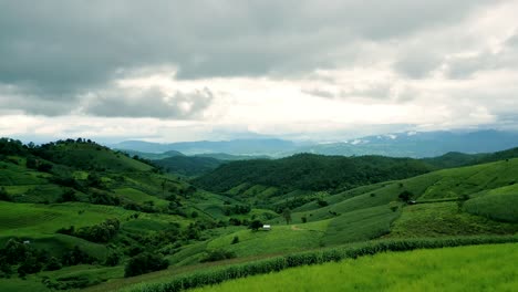 4K-Cinematic-nature-aerial-drone-footage-of-the-beautiful-mountains-and-rice-terraces-of-Ban-Pa-Pong-Piang-at-Doi-Ithanon-next-to-Chiang-Mai,-Thailand-on-a-cloudy-sunny-day