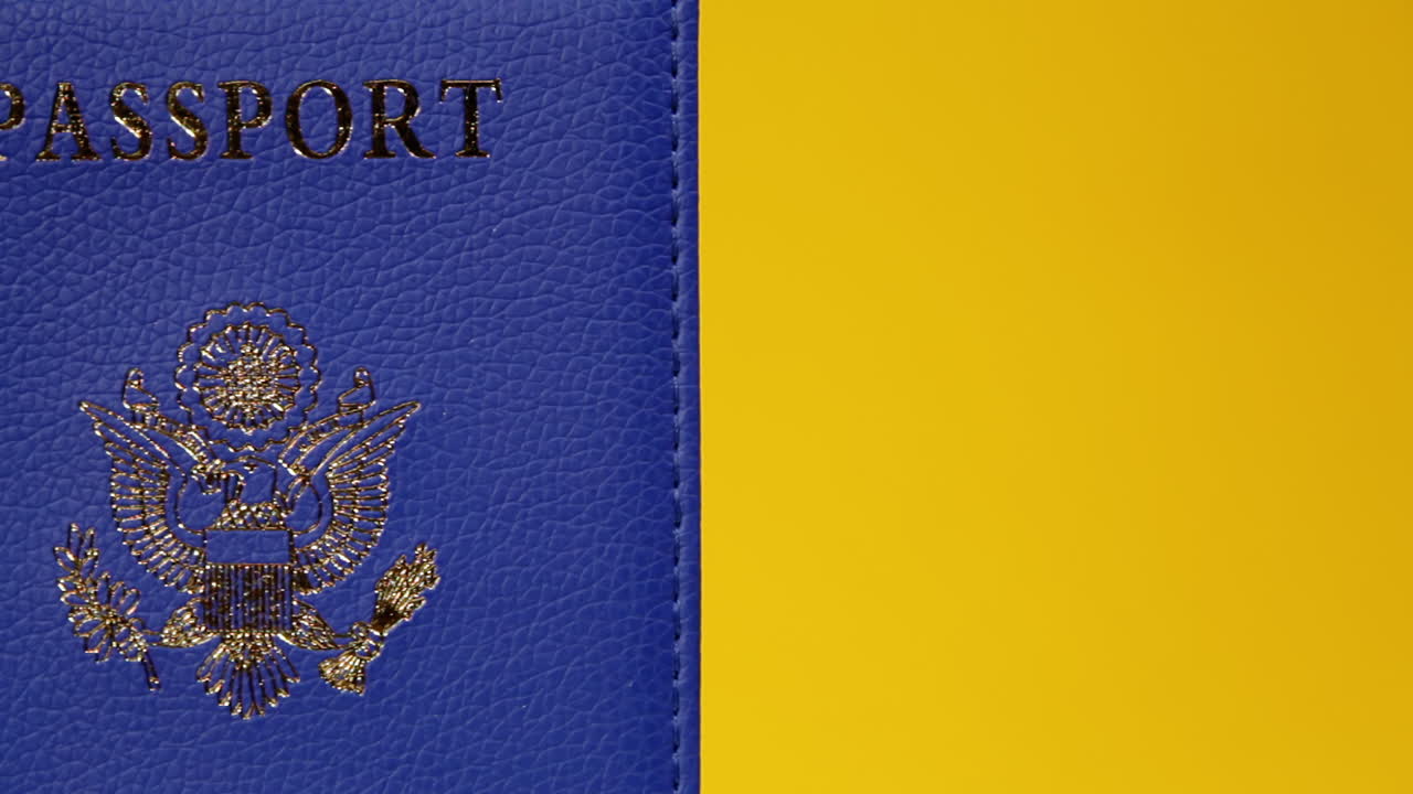 A blue passport, with the emblem United States of America, on a rotating surface