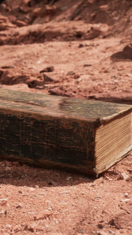 old book in red rock desert