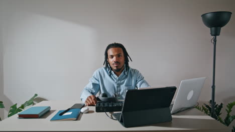 Positive-arranger-posing-camera-home-zoom-on.-Handsome-sound-producer-relaxing