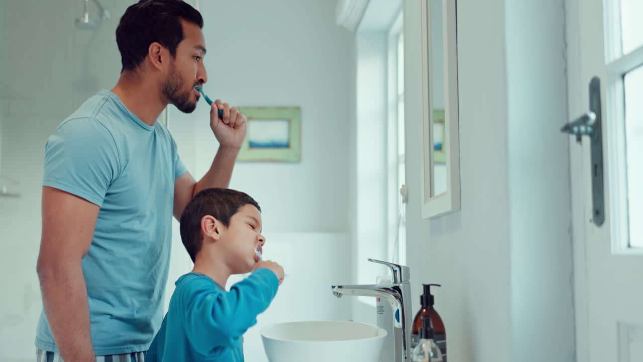 Father, child and brushing teeth in family home