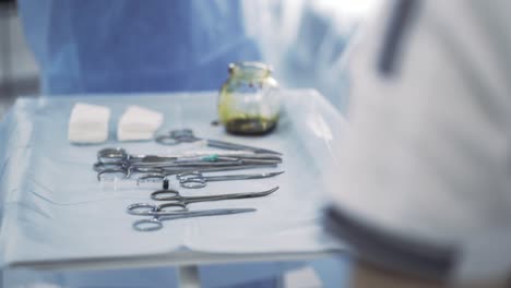 surgical instruments on a tray in an operating room