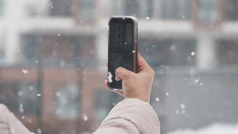 taking a picture in the snow