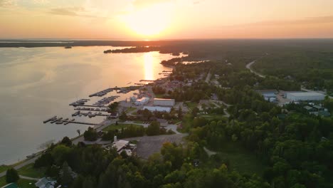 Aerial-sunset-view-of-Hessel-Michigan-golden-hour,-Les-Cheneaux-Islands