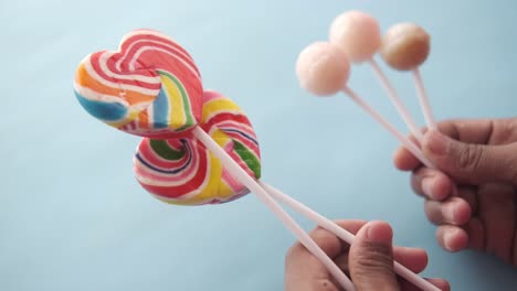 colorful lollipops in hands