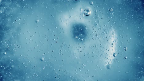 oxygen bubbles in water on a blue abstract background