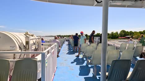 passengers enjoying a sunny boat ride