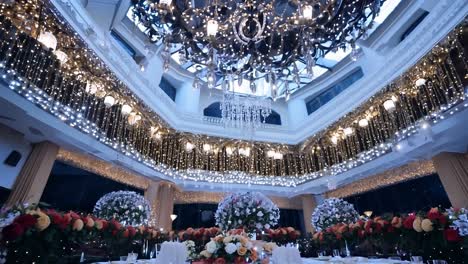 luxurious restaurant preparing for a christmas party, featuring elegant decorations and festive table settings