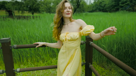 gorgeous young lady posing in elegant yellow puff sleeves dress outdoor