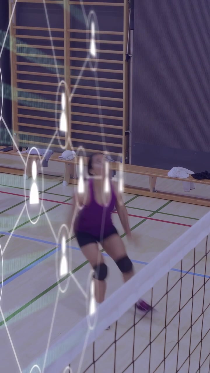 Vertical video: Two women stepping to net after volleyball flying across court, training with AR