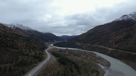 aerial pulls back on the jack river and highway 3 outside of denali national park, alaska with fall colors