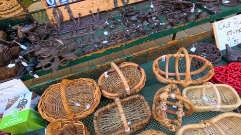 assortment of wicker and metal baskets and decor at outdoor market