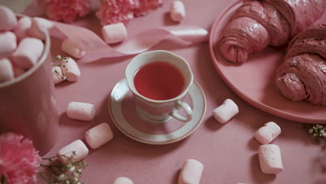 cup of tea on pink table