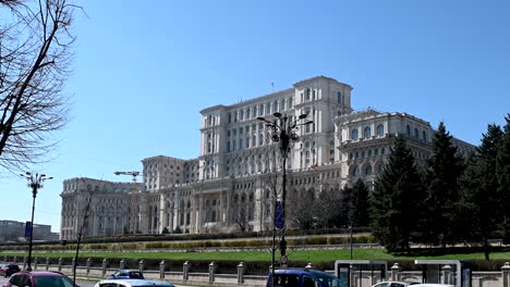 traffic passing the palace of parliament, palatul parlamentului, bucharest, romania, europe