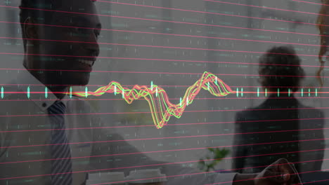 discussing animated financial graph, business professionals in modern office setting