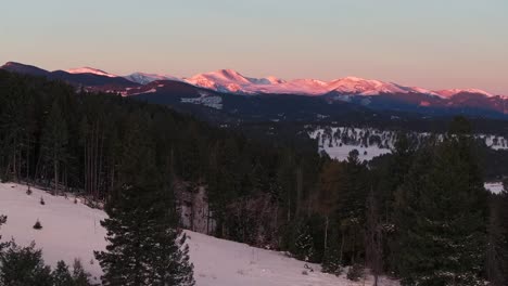 pink red mount blue sky evans 14er evergreen meadows conifer colorado aerial drone golden cold sunrise early morning winter snow valley forest december rocky mountains town left glide motion