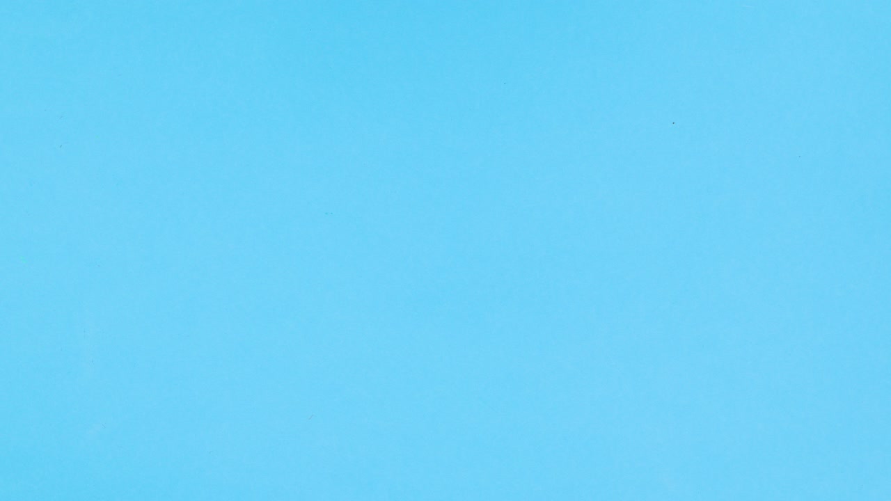 Slices of fruits making smiley on blue theme. Stop motion