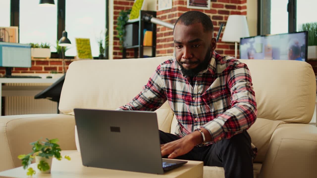 Man working on laptop at home