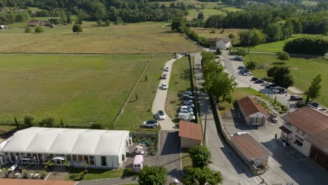 aerial establishing shot of the wedding party arriving at the wedding venue