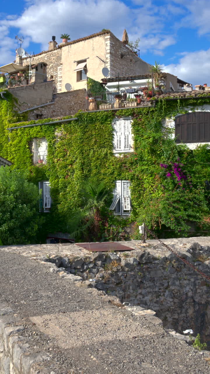 View of the buildings on the streets of the city in daylight. Vertical, Saint Paul de Vence, France