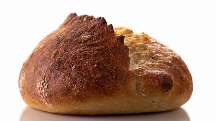 Freshly baked bread rotates on a white background, front view, stop motion, 3D.
