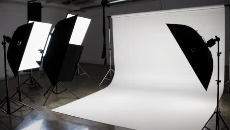 empty photography studio with white backdrop