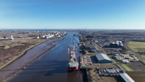 River-Tees-jack-up-vessels-on-berth-offshore-wind-support,-Leviathan-and-Seajacks-Hydra---March-2023---Aerial-drone-prores-footage-pull-back---clip-3