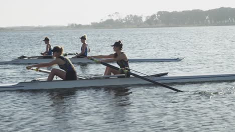 female rowing team training on a river