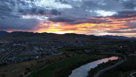 Golden-sunset-over-a-suburban-golf-course---pullback-aerial