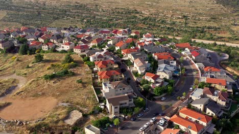 aerial view of a residential neighborhood in a hilly, arid landscape