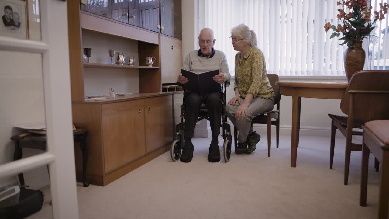 Elderly couple in their living room