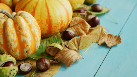Pumpkins-decorated-with-chestnuts-and-leaves